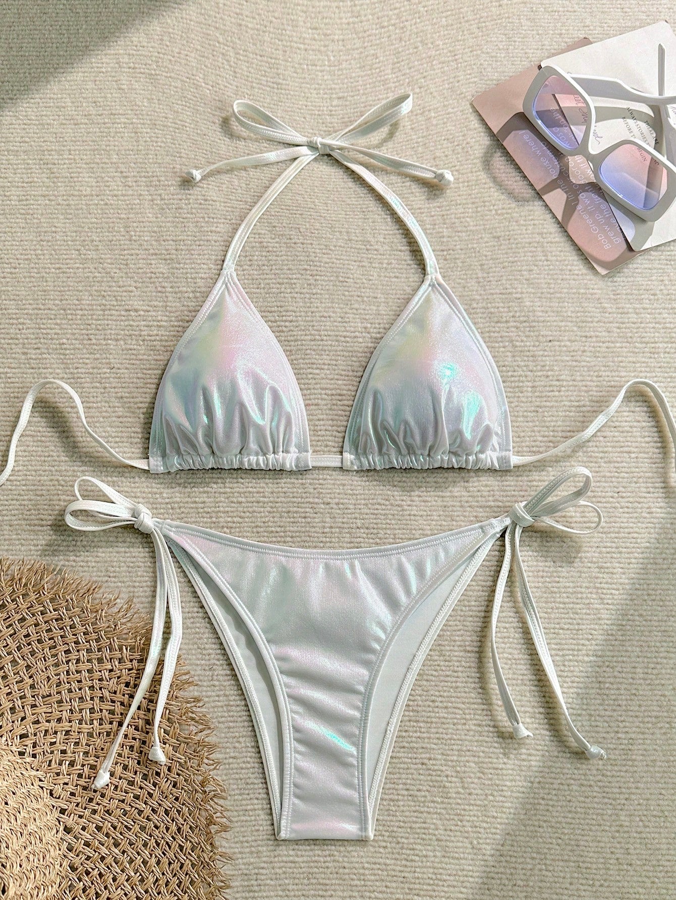 Women's two-piece halter triangle bikini set featuring tie-side high-waist bottoms and tie-back top.