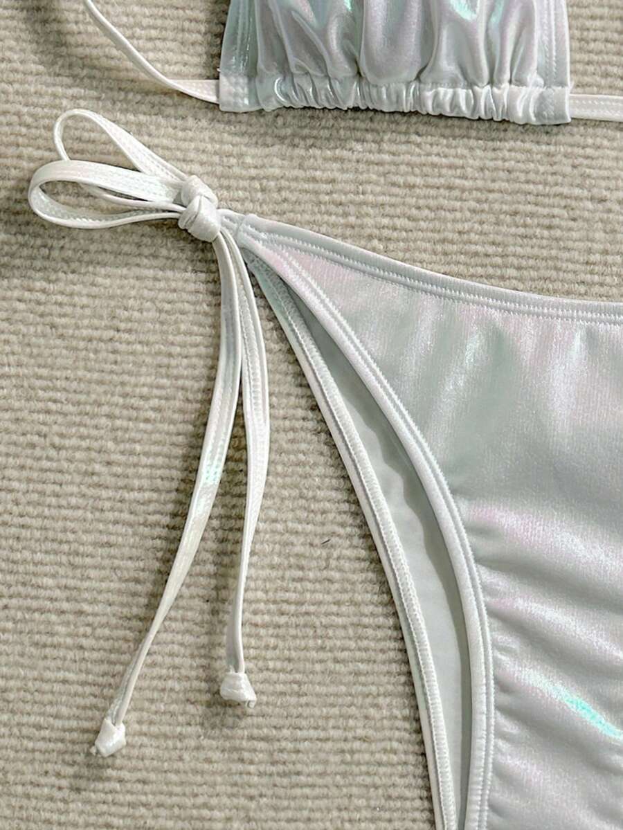 Women's two-piece halter triangle bikini set featuring tie-side high-waist bottoms and tie-back top.