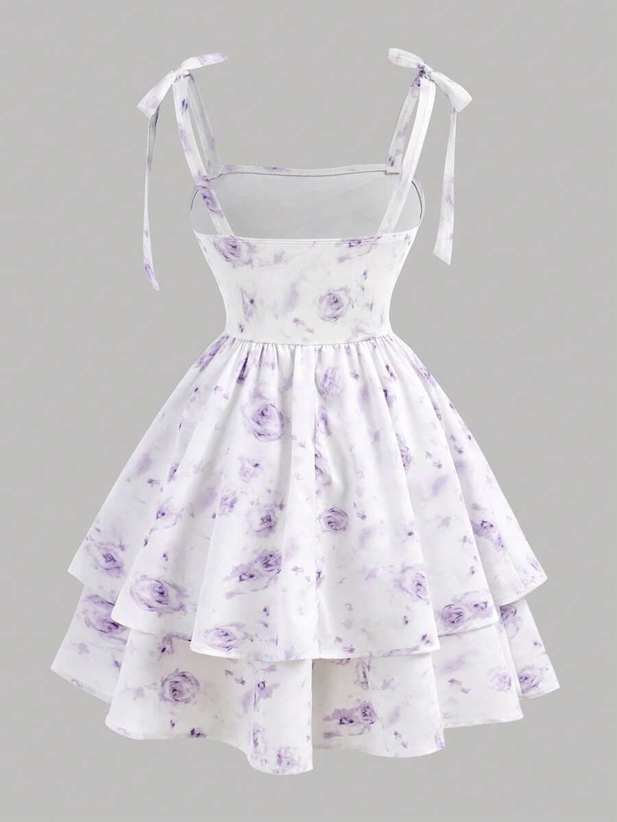 Black and white polka dot cami dress for tween girls featuring sleeveless straps, a shirred high waist, flared hem, and slim fit silhouette.