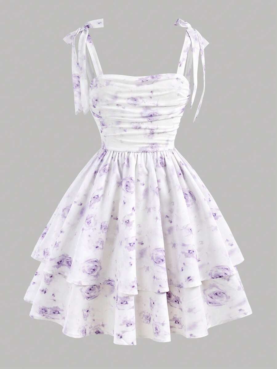 Black and white polka dot cami dress for tween girls featuring sleeveless straps, a shirred high waist, flared hem, and slim fit silhouette.