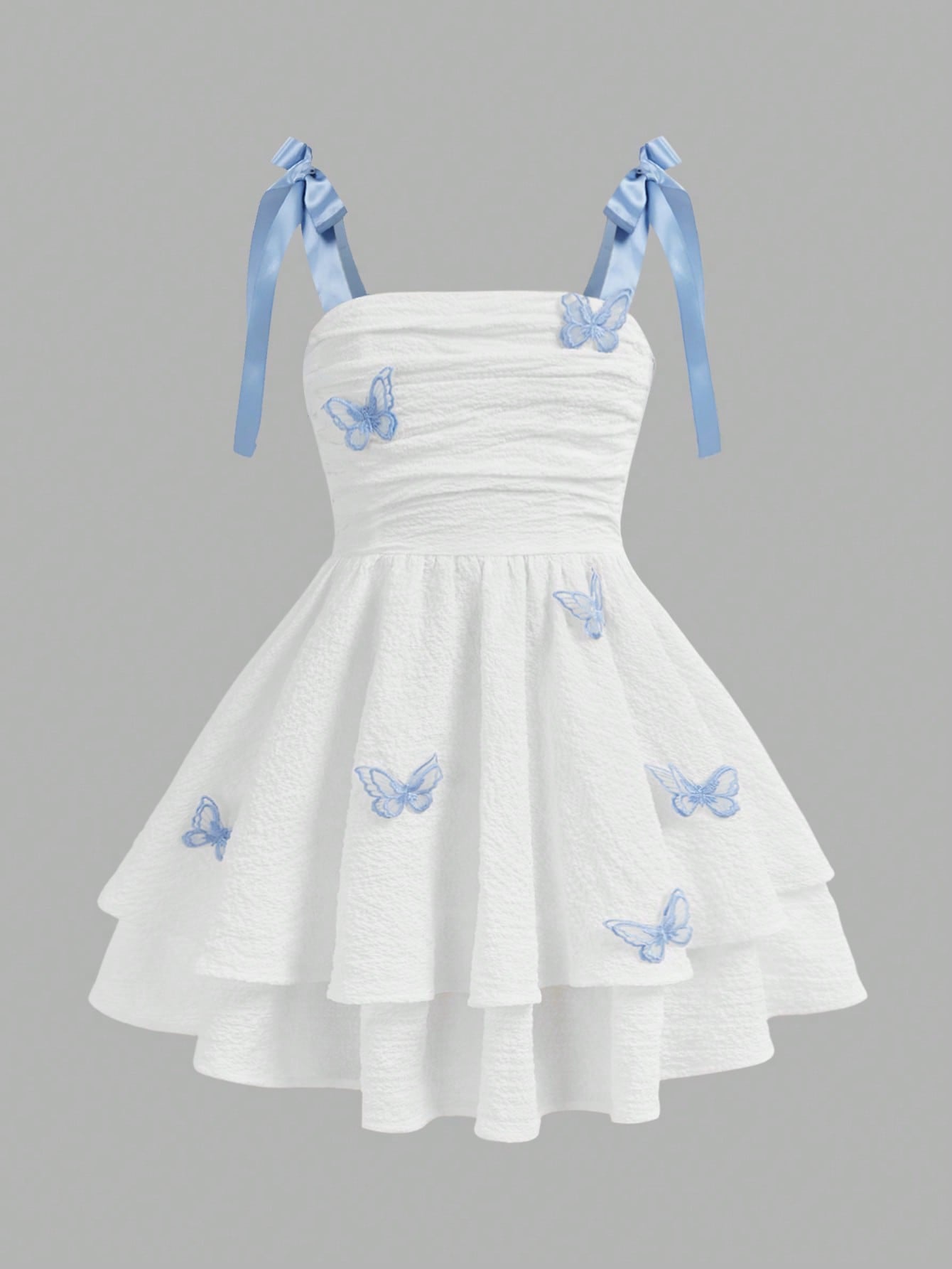 Tween girls apricot tiered cami dress with spaghetti straps, high waist, and slim fit layered hem.