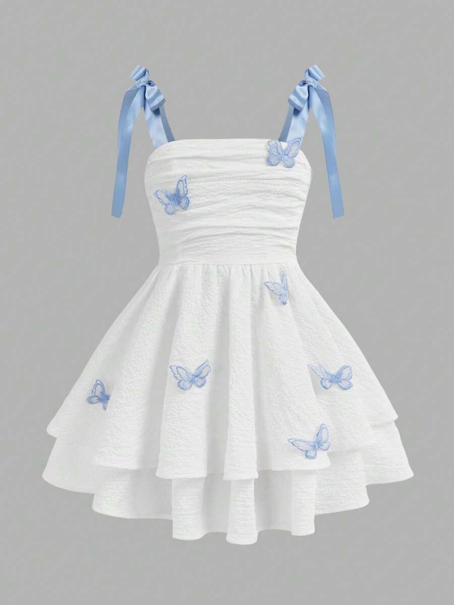 Tween girls apricot tiered cami dress with spaghetti straps, high waist, and slim fit layered hem.