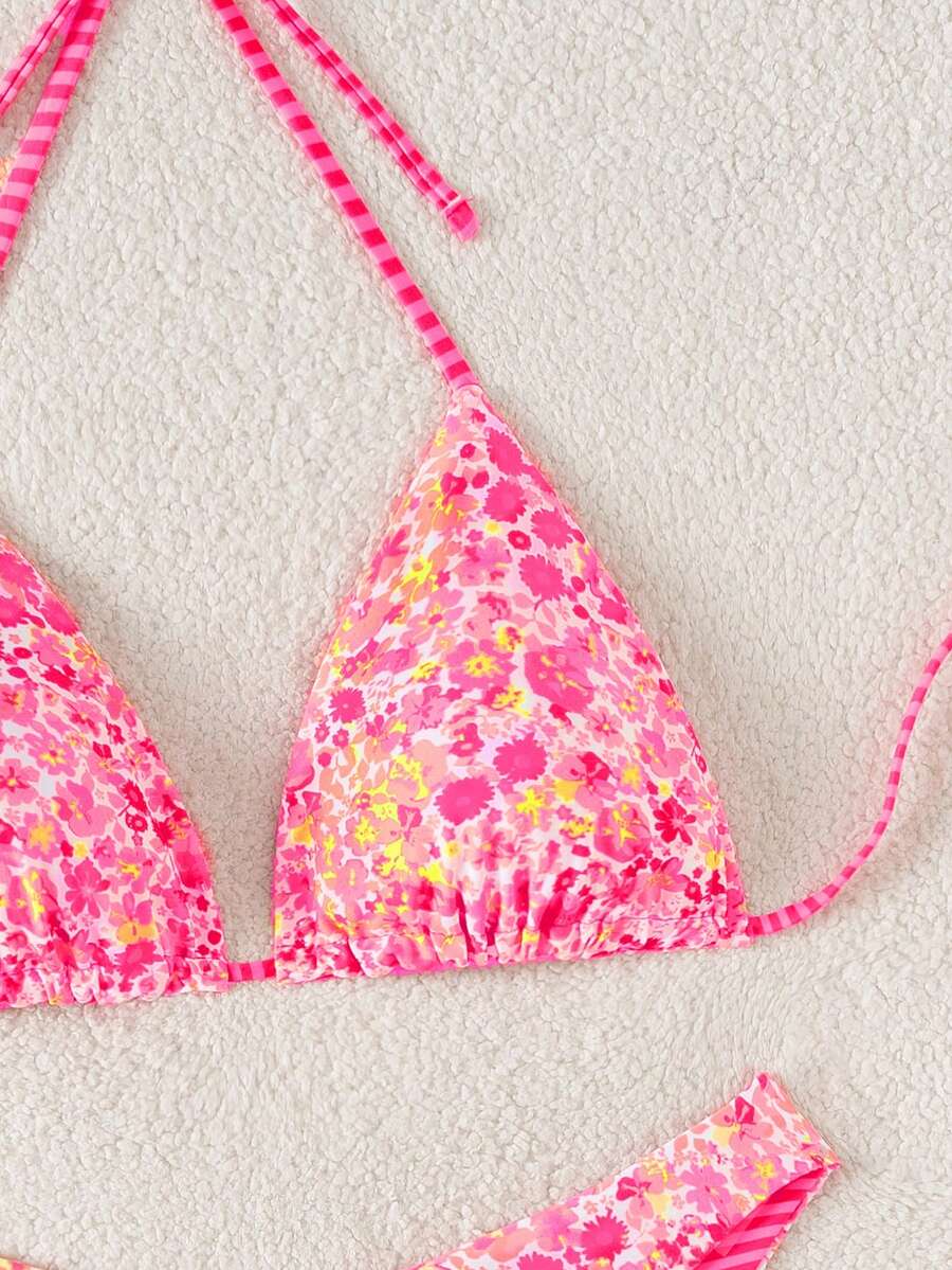 Women's two-piece halter bikini set featuring high cut thong bottoms and removable padding