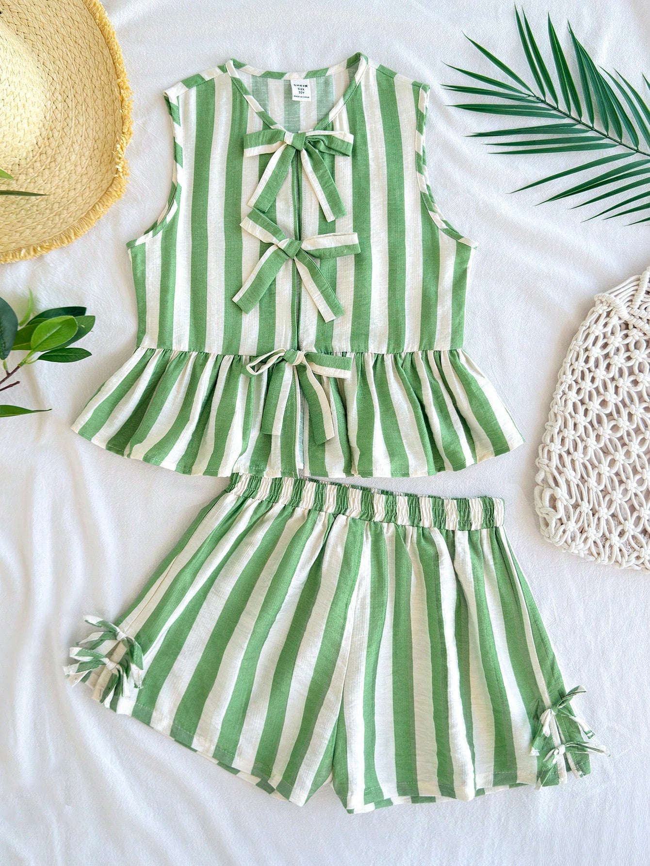Tween girls green and white striped 2-piece summer set featuring a sleeveless bowknot ruffle crop top and casual shorts.