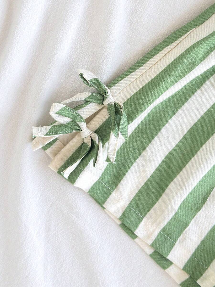 Tween girls green and white striped 2-piece summer set featuring a sleeveless bowknot ruffle crop top and casual shorts.
