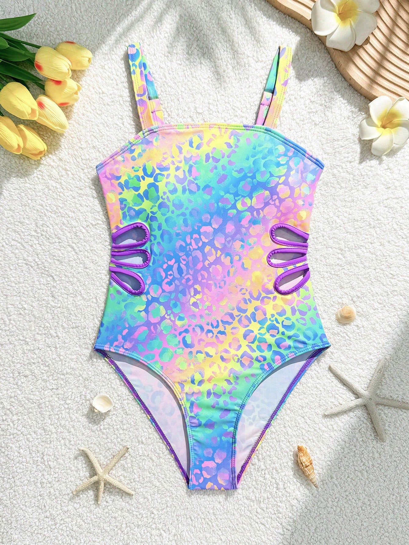 Tween girls one-piece swimsuit with a floral plant print, spaghetti straps, and a mid-waist fit in black.