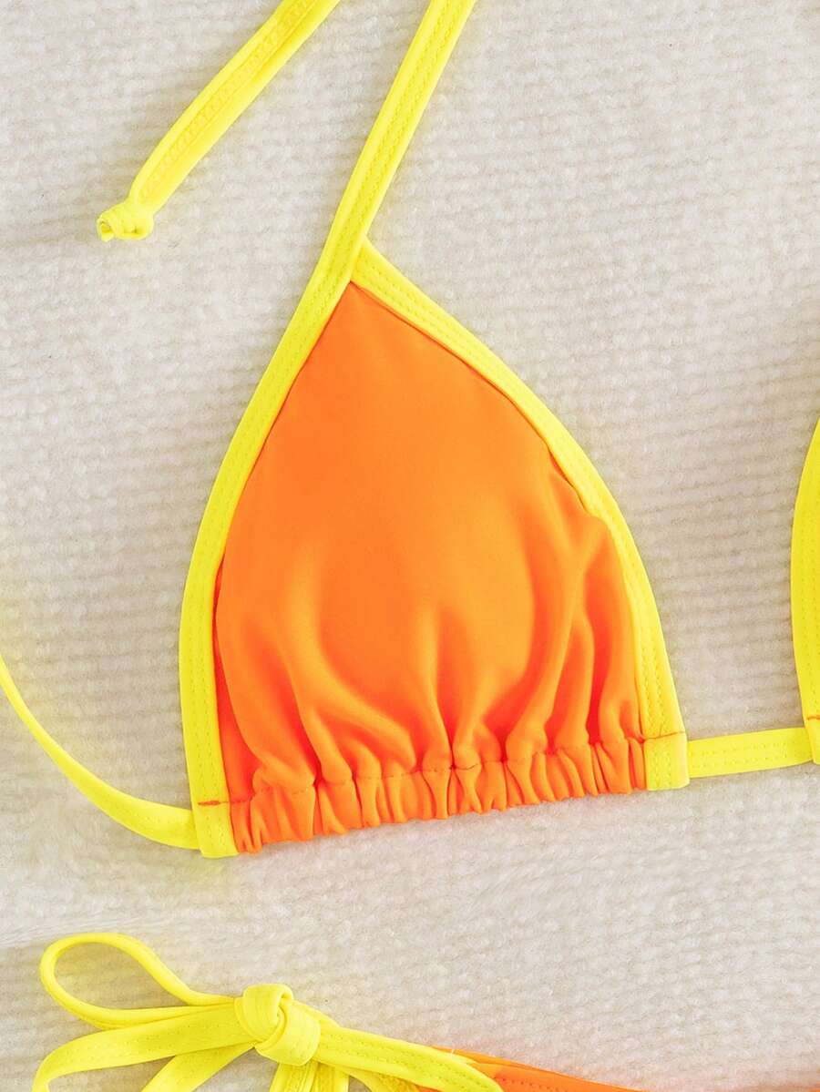 Women's two-piece halter triangle bikini set featuring a backless tie-back top with removable padding and matching tie-side mid-waist bottoms.