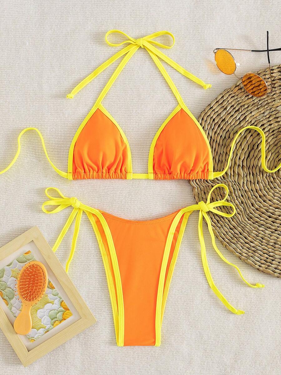 Women's two-piece halter triangle bikini set featuring a backless tie-back top with removable padding and matching tie-side mid-waist bottoms.