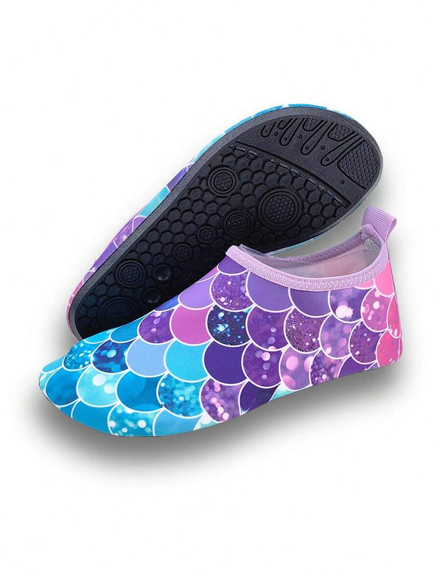 Girls purple slip-on water sandals with a textured fish scale pattern, breathable fabric upper, and flexible TPR sole.