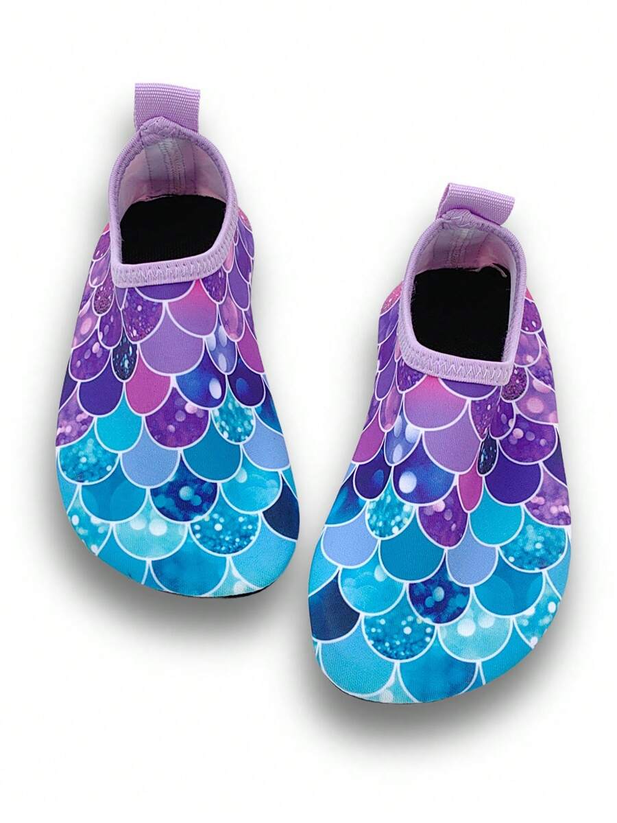 Girls purple slip-on water sandals with a textured fish scale pattern, breathable fabric upper, and flexible TPR sole.