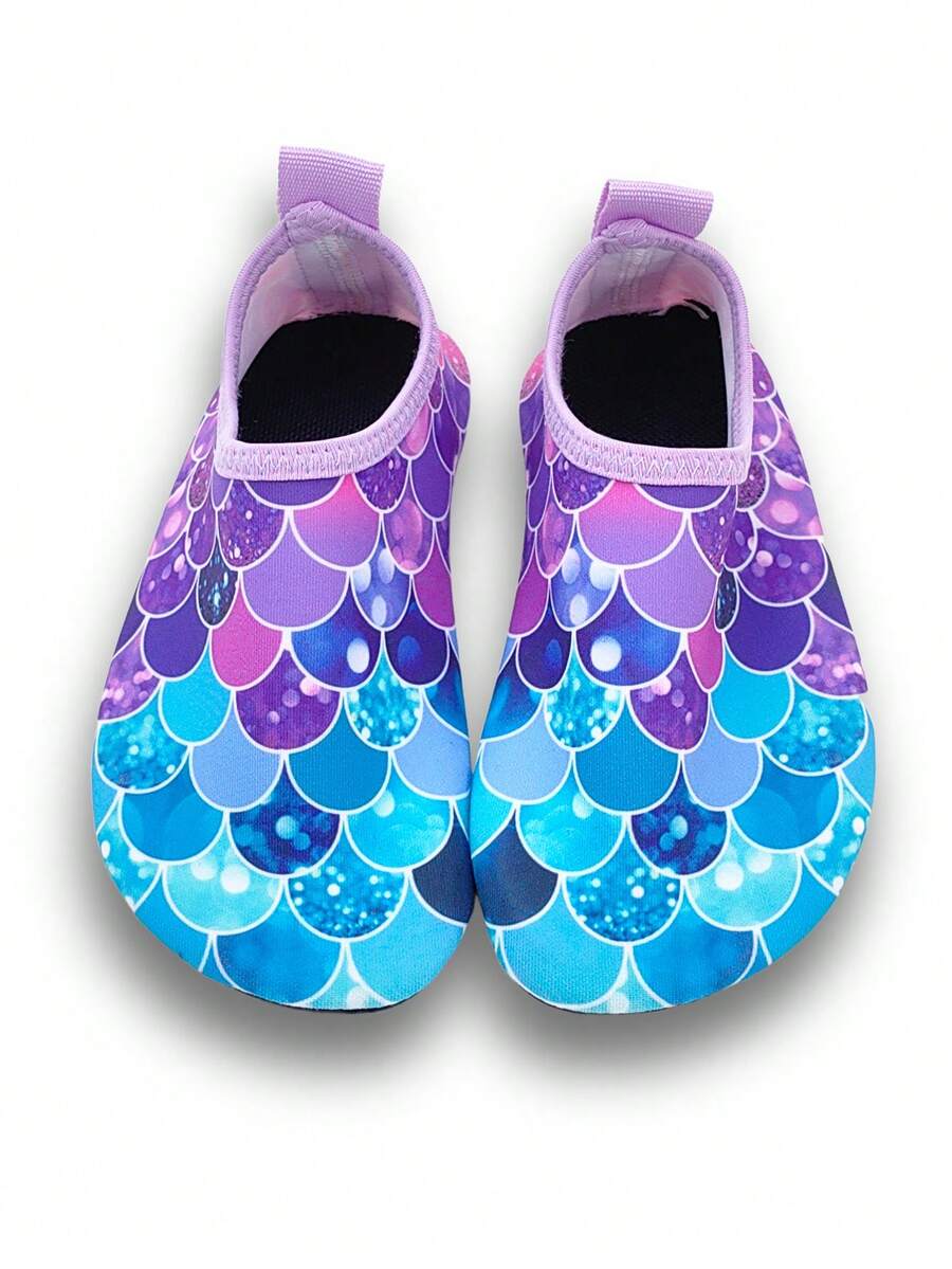 Girls purple slip-on water sandals with a textured fish scale pattern, breathable fabric upper, and flexible TPR sole.