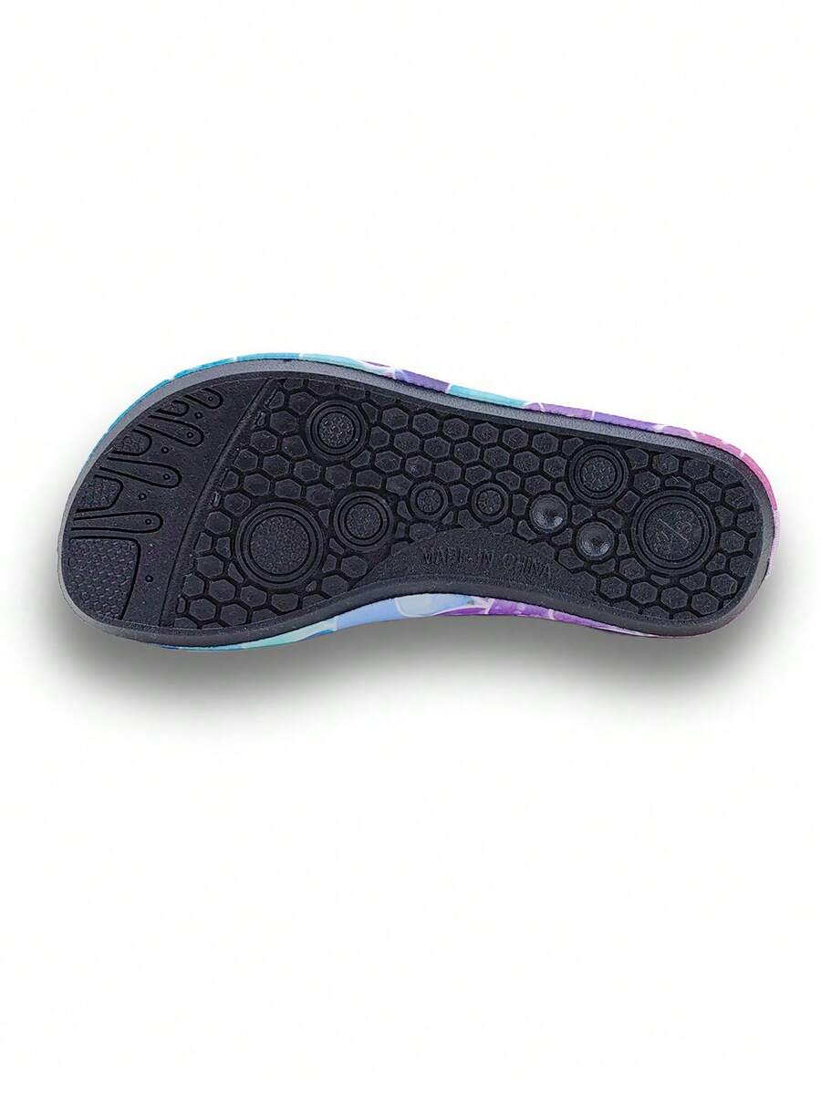 Girls purple slip-on water sandals with a textured fish scale pattern, breathable fabric upper, and flexible TPR sole.