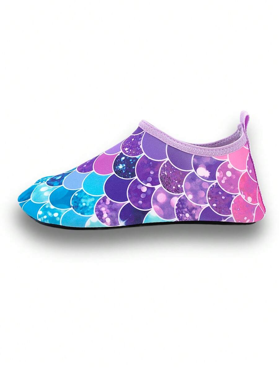 Girls purple slip-on water sandals with a textured fish scale pattern, breathable fabric upper, and flexible TPR sole.