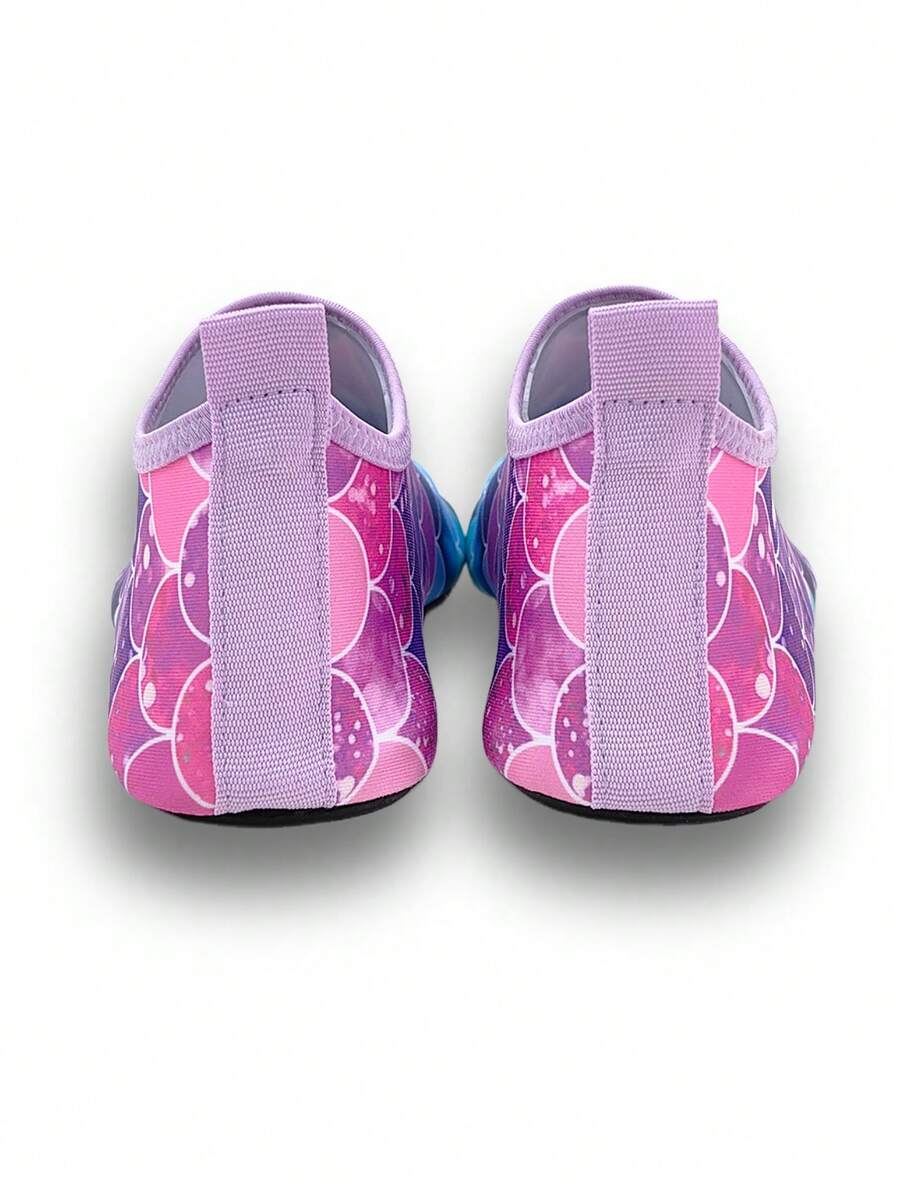 Girls purple slip-on water sandals with a textured fish scale pattern, breathable fabric upper, and flexible TPR sole.