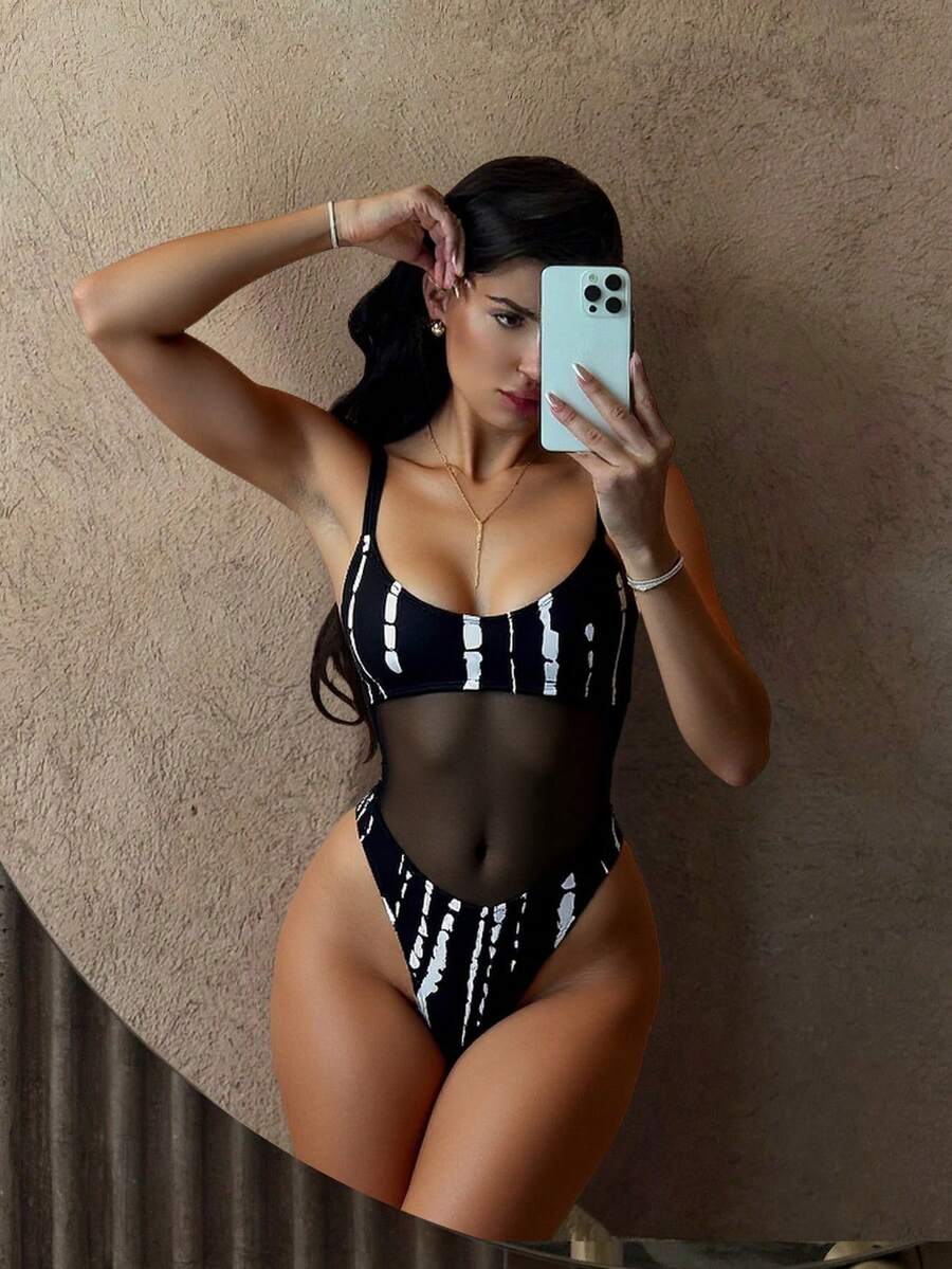 Black floral print mesh patchwork one-piece swimsuit for women featuring spaghetti straps, V-wired triangle cups, and a high waist silhouette.