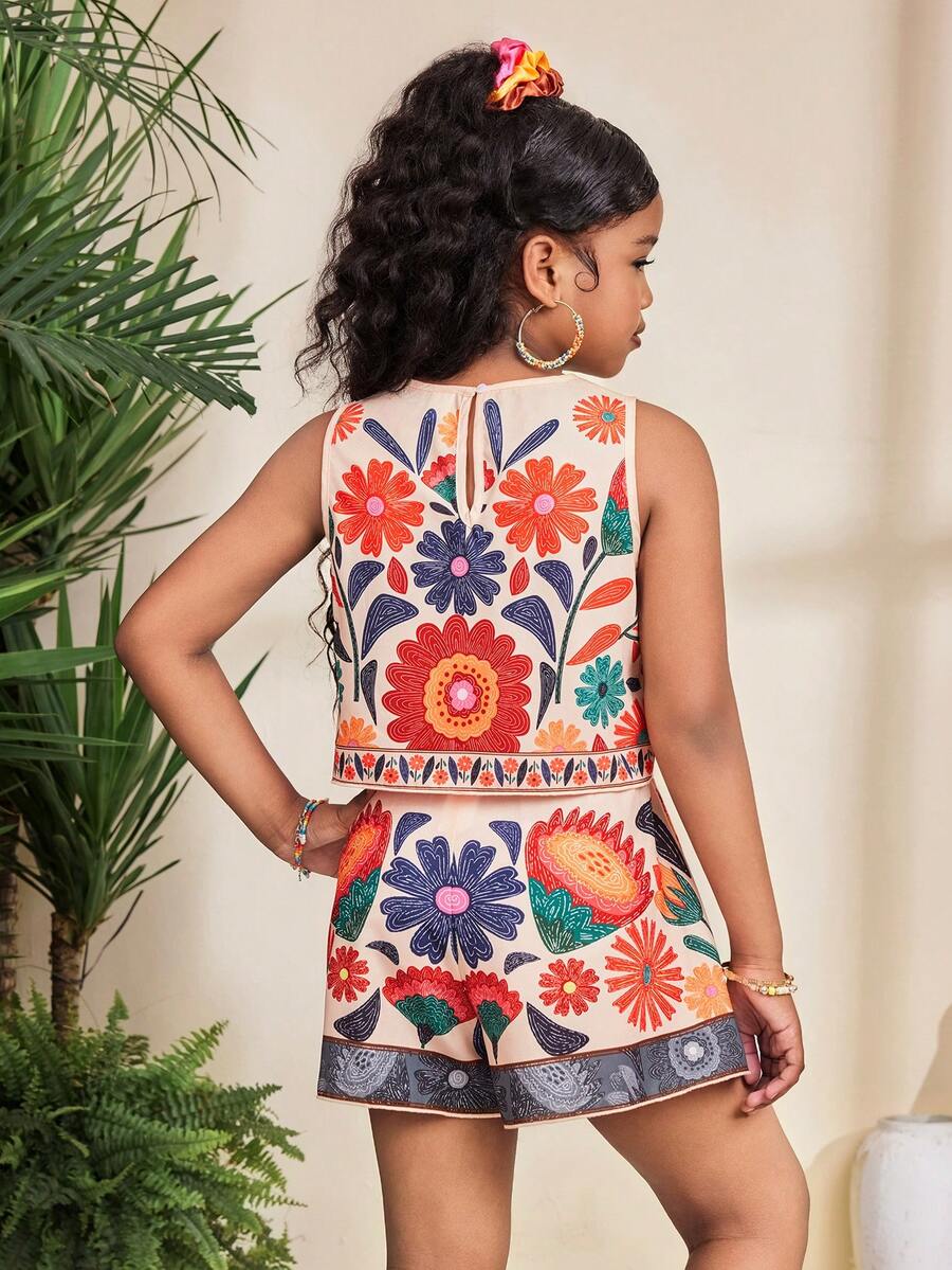 Tween girl wearing a tropical floral print two-piece vacation set featuring a sleeveless round neck tank top with button details and matching shorts.
