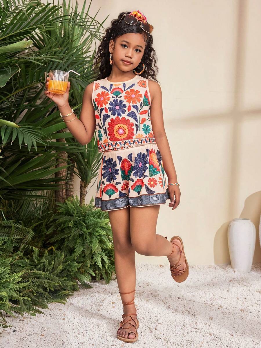 Tween girl wearing a tropical floral print two-piece vacation set featuring a sleeveless round neck tank top with button details and matching shorts.
