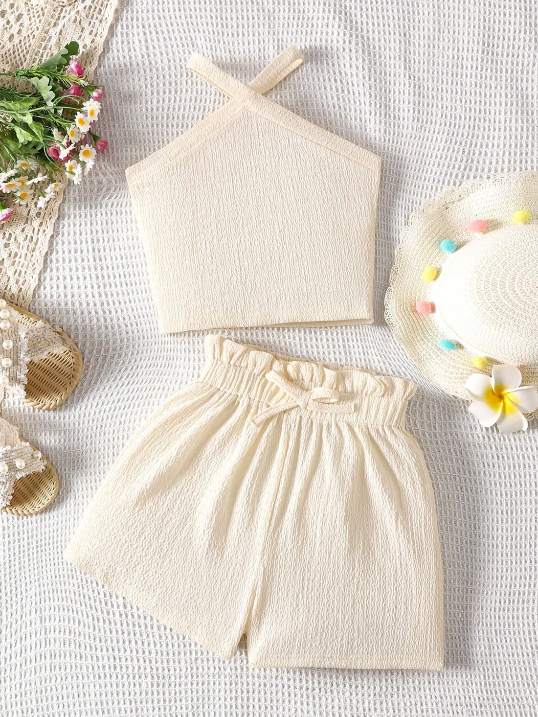 Tween girl 2-piece casual outfit set featuring a solid beige knit halter sleeveless top with belted detail and matching shorts.