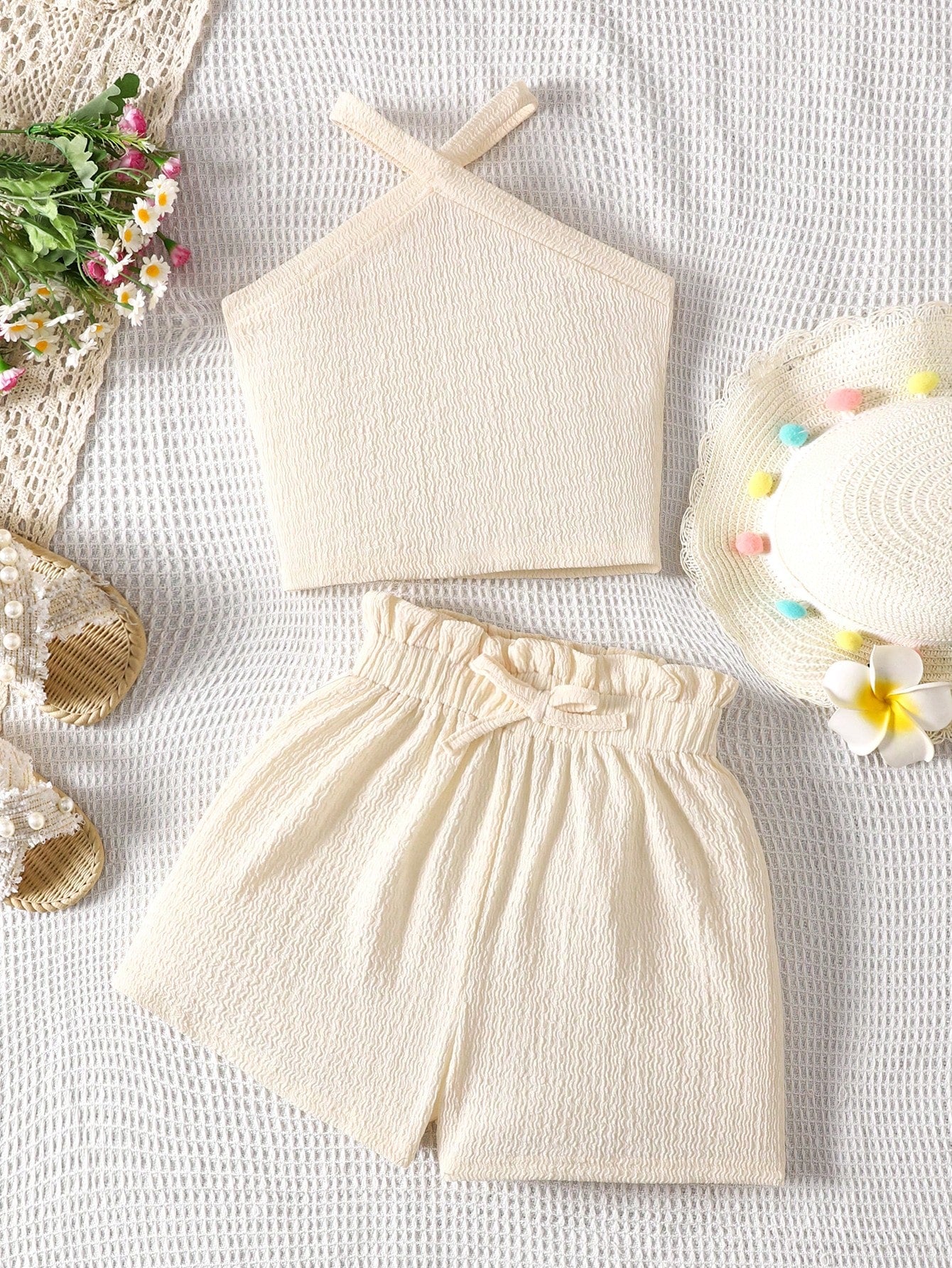 Tween girl 2-piece casual outfit set featuring a solid beige knit halter sleeveless top with belted detail and matching shorts.