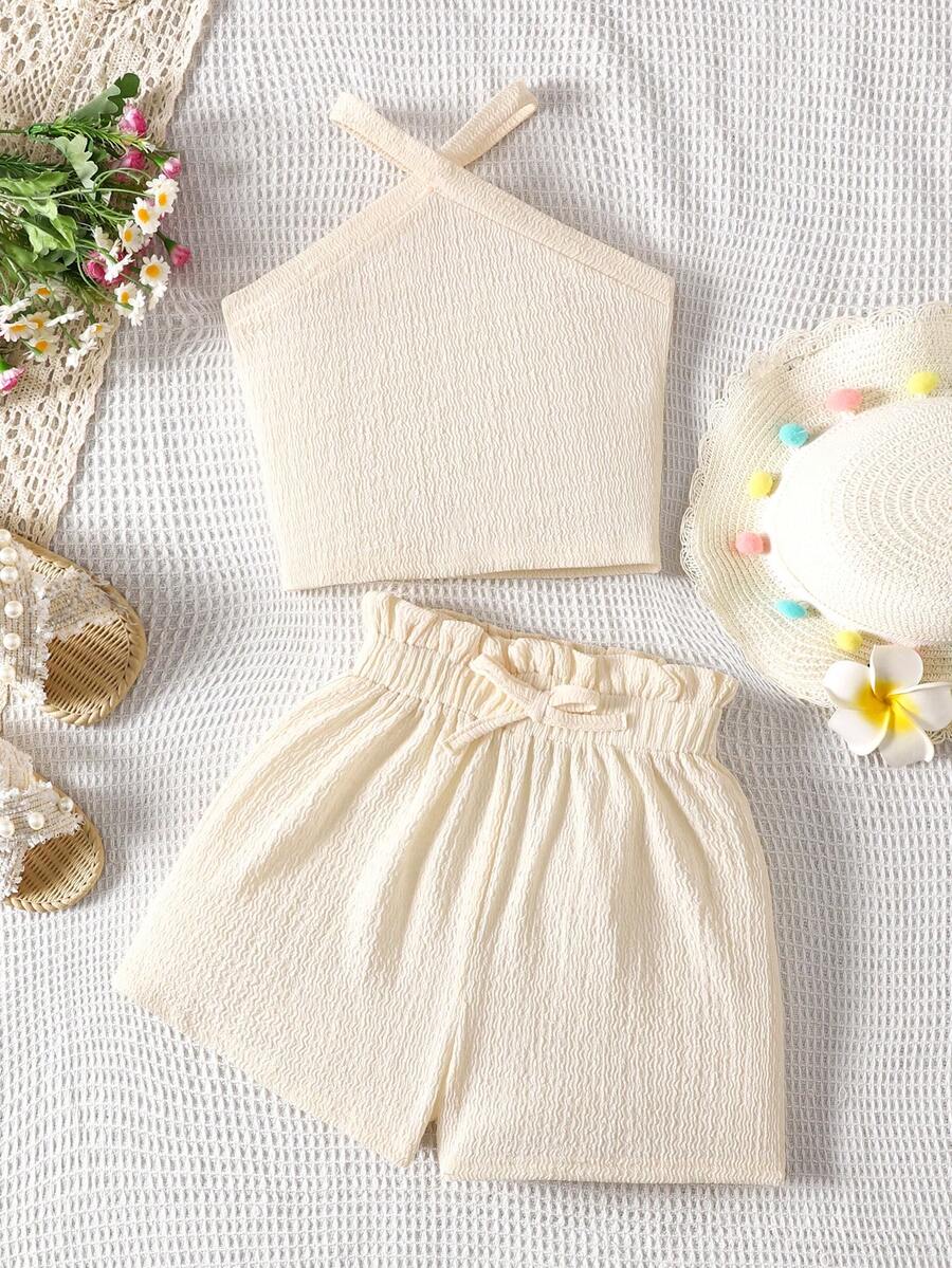 Tween girl 2-piece casual outfit set featuring a solid beige knit halter sleeveless top with belted detail and matching shorts.