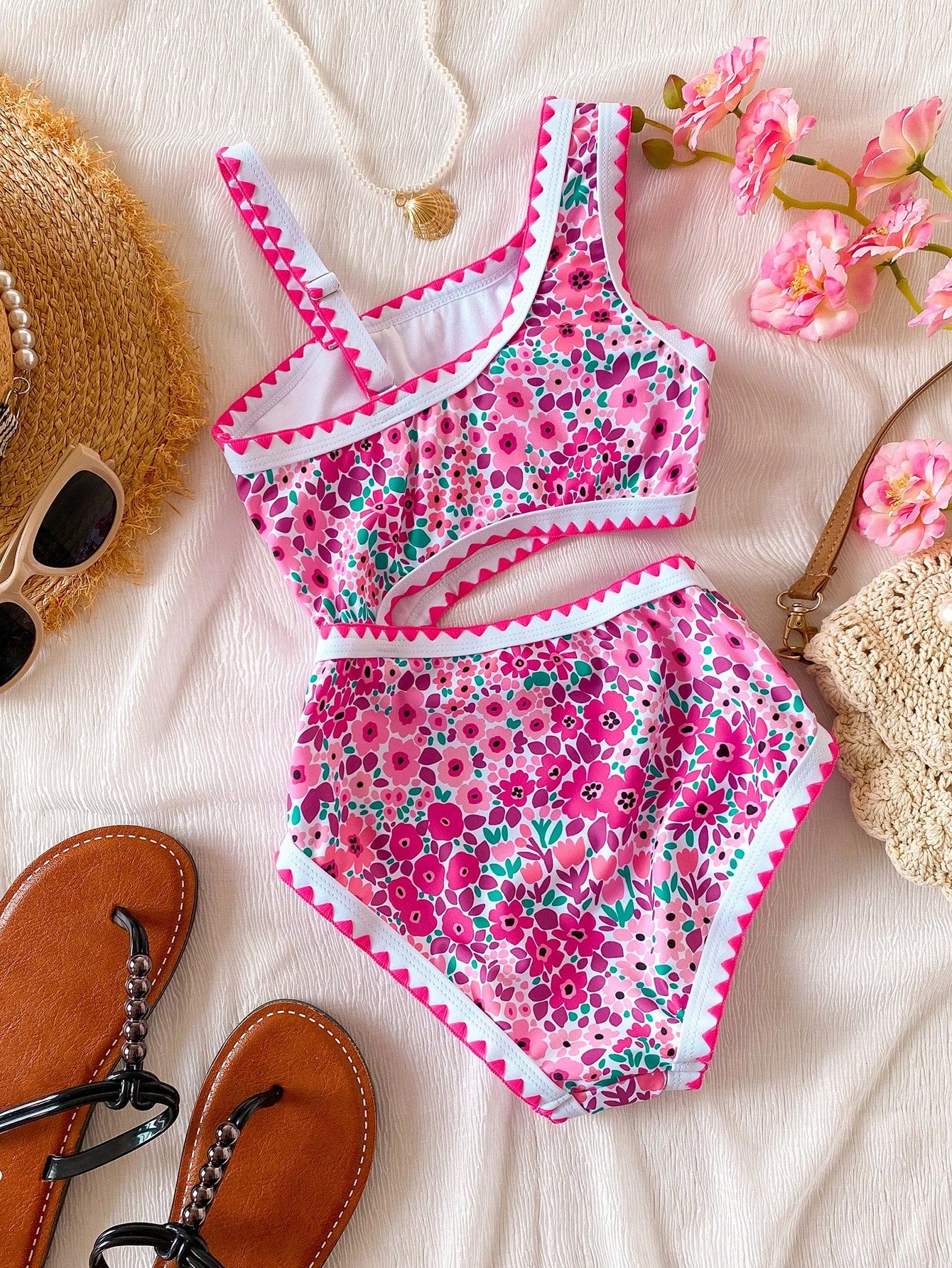Tween girls one-piece swimsuit featuring an asymmetric neckline, pendant decor, plain design, wireless bra, high-cut bottom, and medium-stretch fabric.