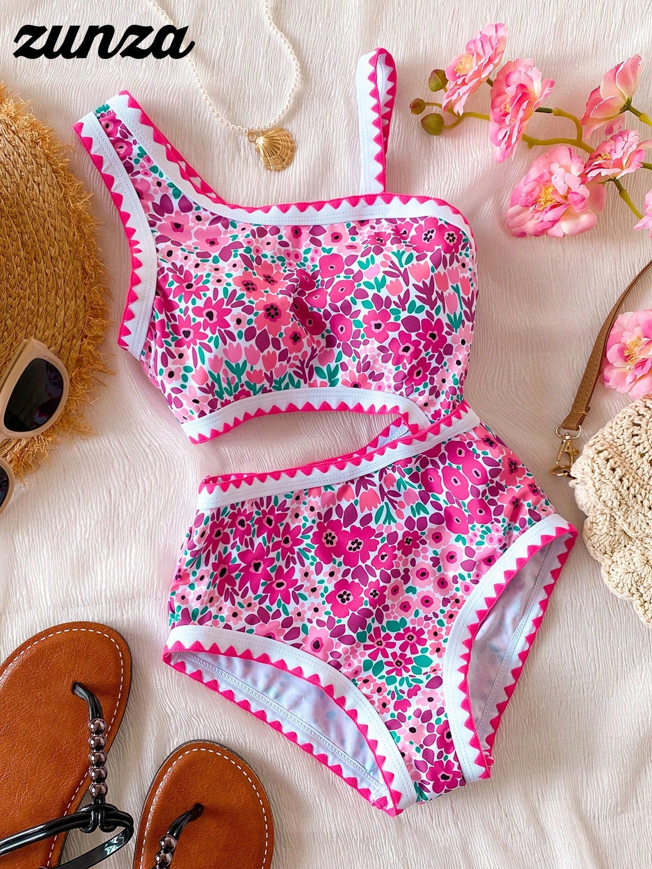 Tween girls one-piece swimsuit featuring an asymmetric neckline, pendant decor, plain design, wireless bra, high-cut bottom, and medium-stretch fabric.