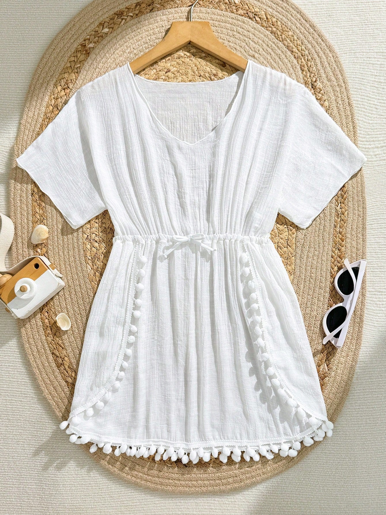 White tween girls swimsuit cover-up with V neck, short sleeves, contrast lace, fringe details, and regular length mesh fabric for beachwear
