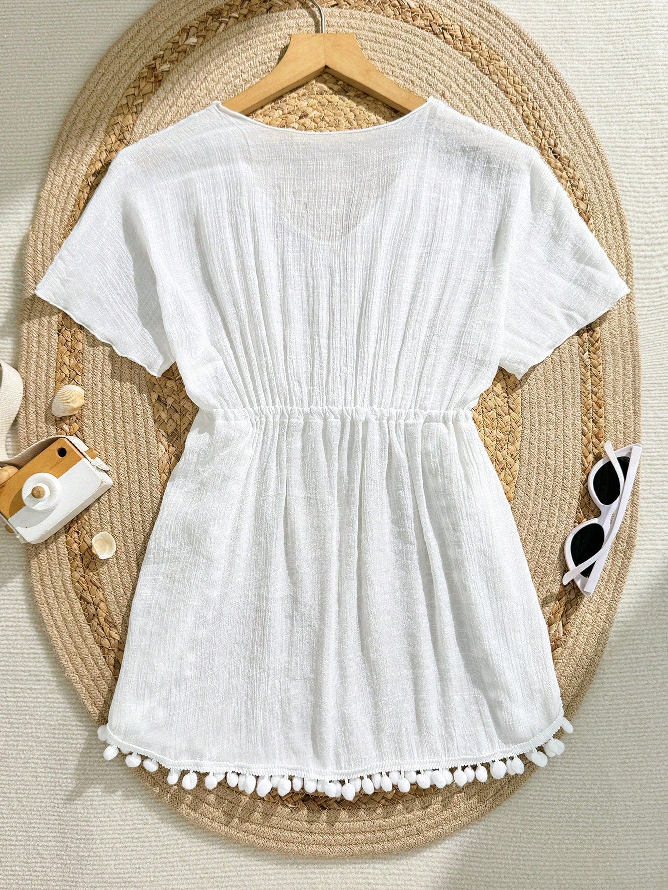 White tween girls swimsuit cover-up with V neck, short sleeves, contrast lace, fringe details, and regular length mesh fabric for beachwear