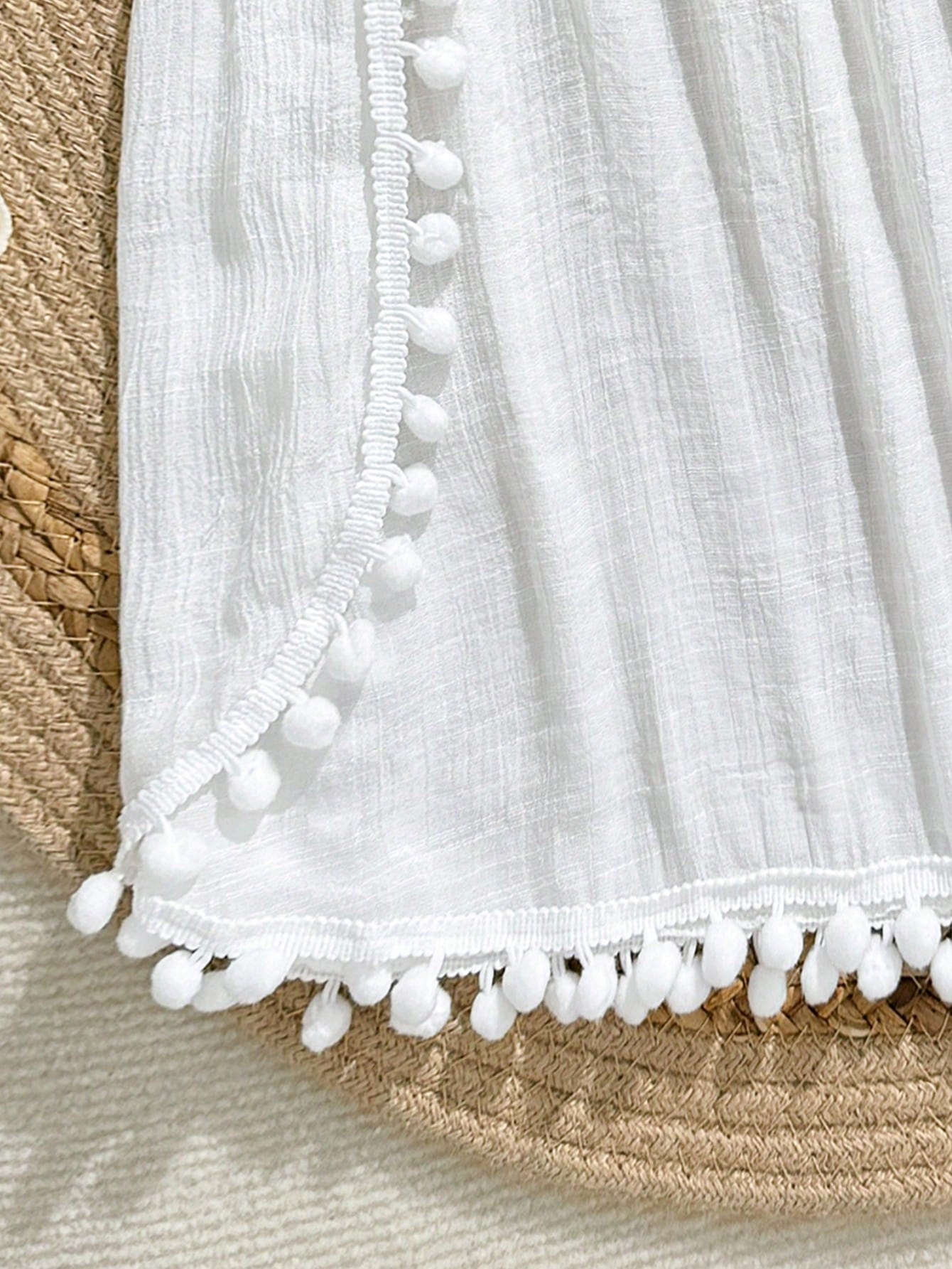 White tween girls swimsuit cover-up with V neck, short sleeves, contrast lace, fringe details, and regular length mesh fabric for beachwear