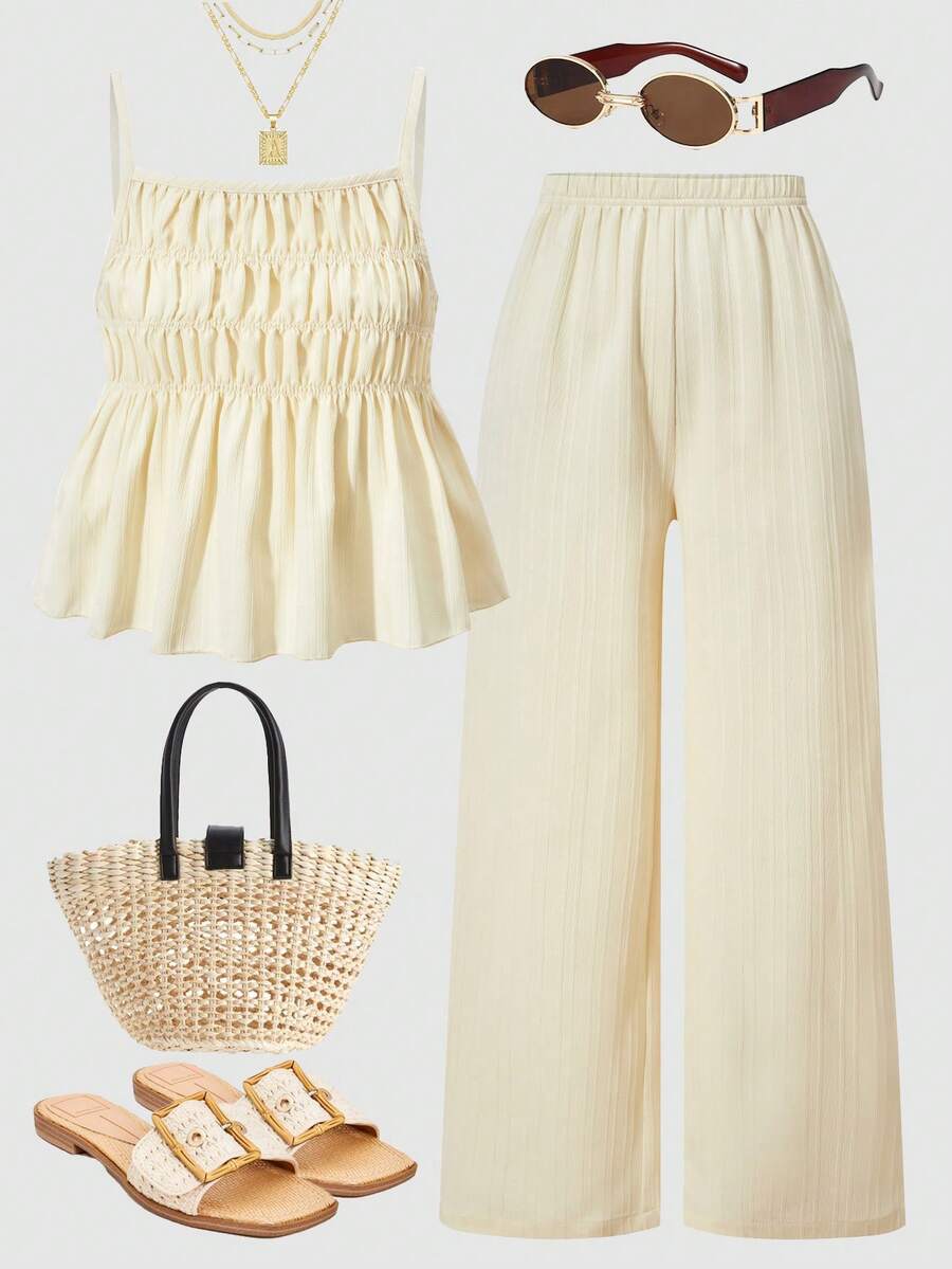 Tween girl wearing an apricot 2-piece outfit set featuring a shirred spaghetti strap short cami top and matching wide-leg long pants.