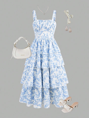 Tween girls blue ditsy floral sleeveless long dress with spaghetti straps, ruched bust, high waist, and tiered layered hem.