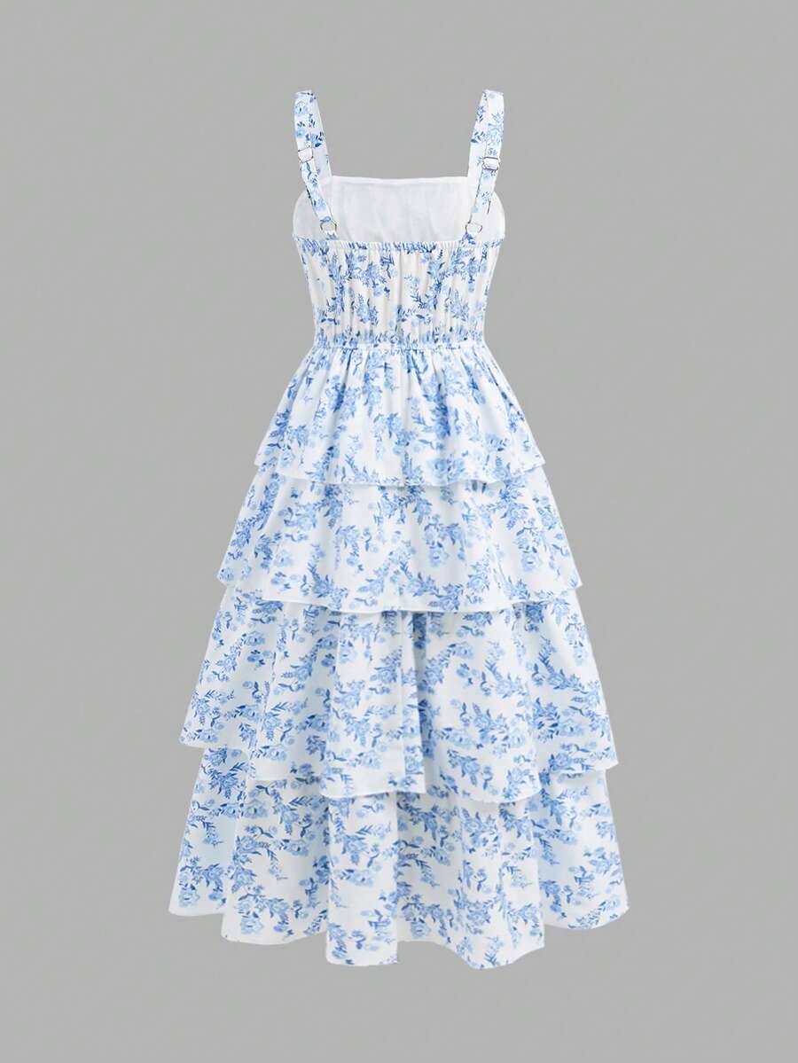 Tween girls blue ditsy floral sleeveless long dress with spaghetti straps, ruched bust, high waist, and tiered layered hem.