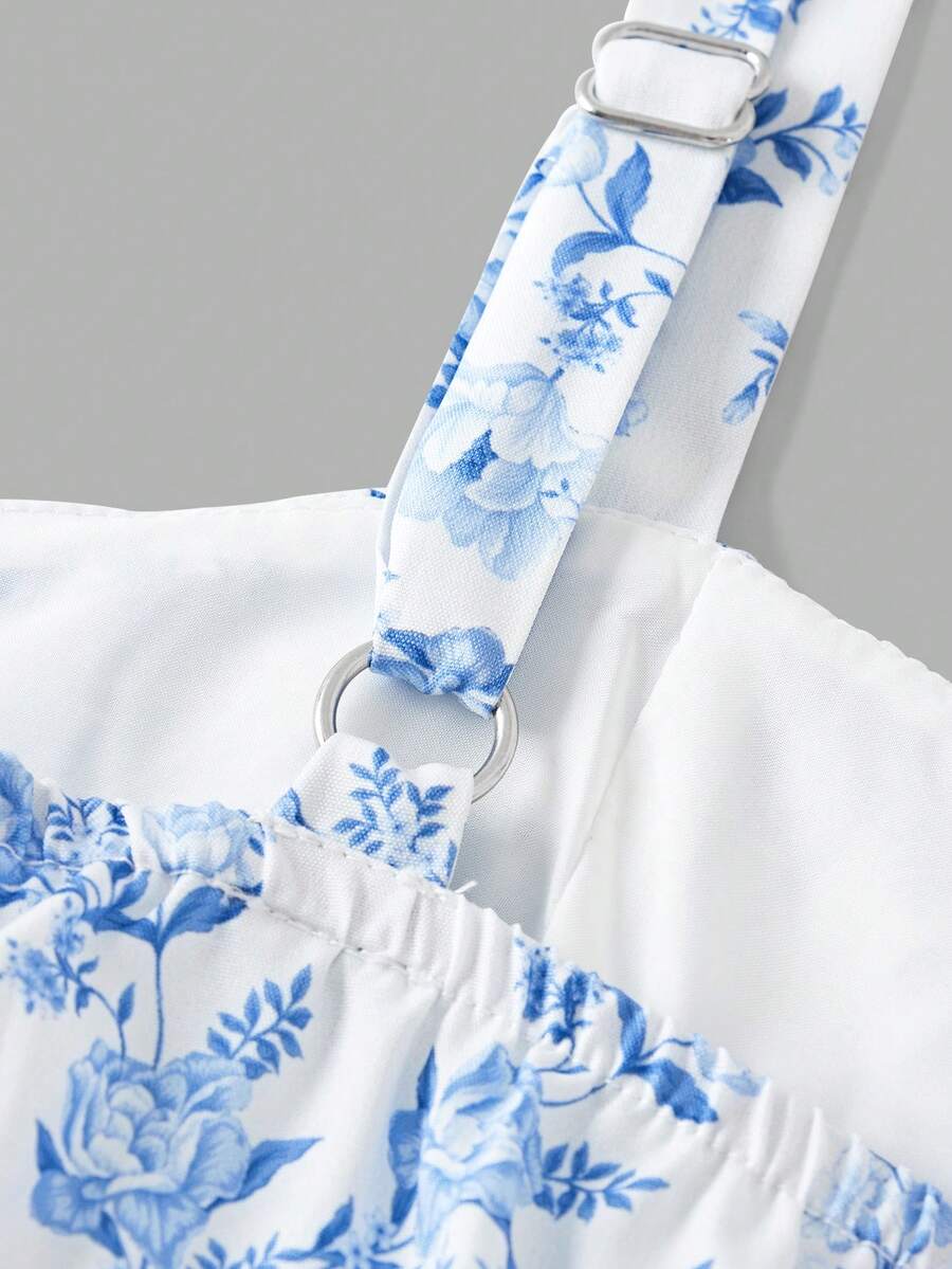 Tween girls blue ditsy floral sleeveless long dress with spaghetti straps, ruched bust, high waist, and tiered layered hem.