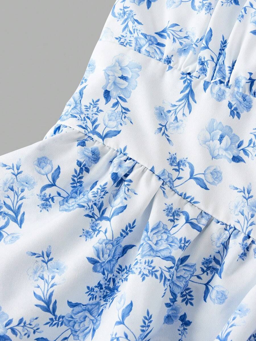 Tween girls blue ditsy floral sleeveless long dress with spaghetti straps, ruched bust, high waist, and tiered layered hem.