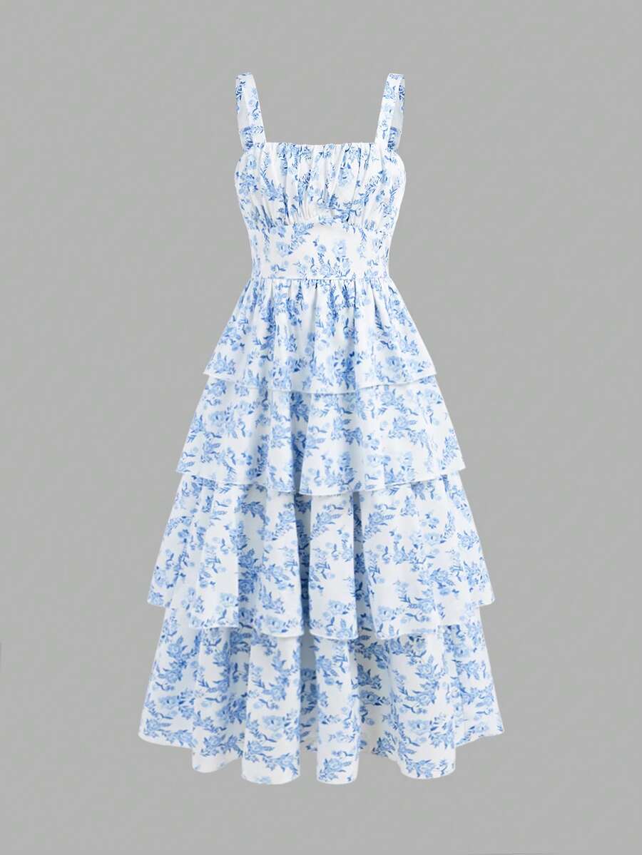 Tween girls blue ditsy floral sleeveless long dress with spaghetti straps, ruched bust, high waist, and tiered layered hem.