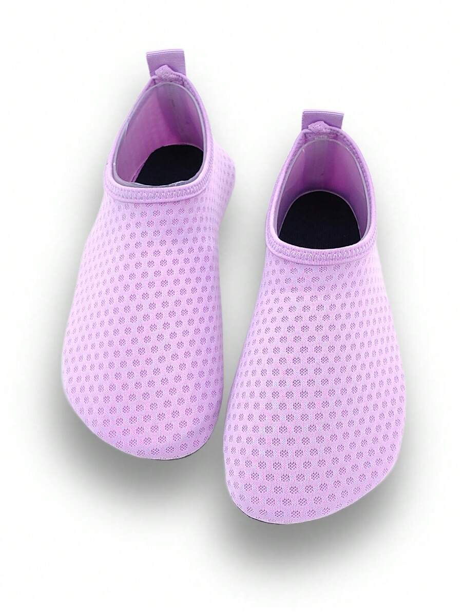 Girls breathable slip-on aqua socks for swimming and beach water sports featuring fabric upper and TPR outsole