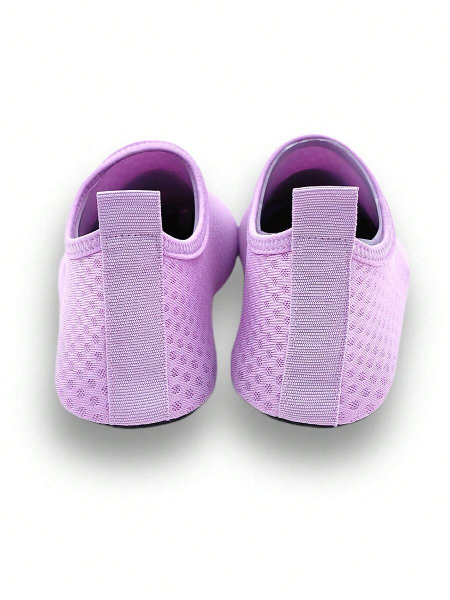 Girls breathable slip-on aqua socks for swimming and beach water sports featuring fabric upper and TPR outsole