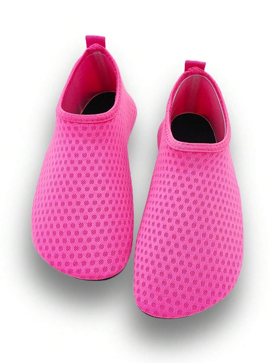 Girls breathable slip-on aqua socks for swimming and beach water sports featuring fabric upper and TPR outsole