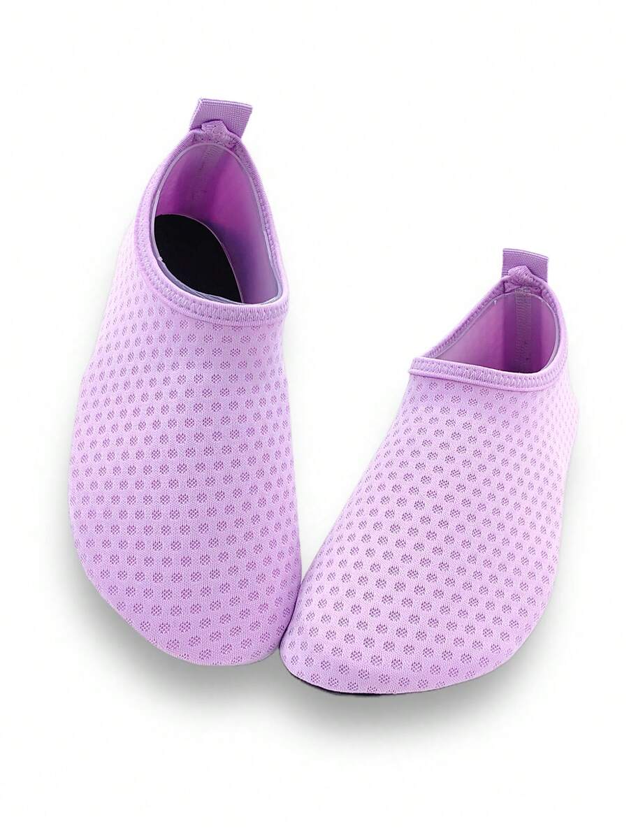 Girls breathable slip-on aqua socks for swimming and beach water sports featuring fabric upper and TPR outsole
