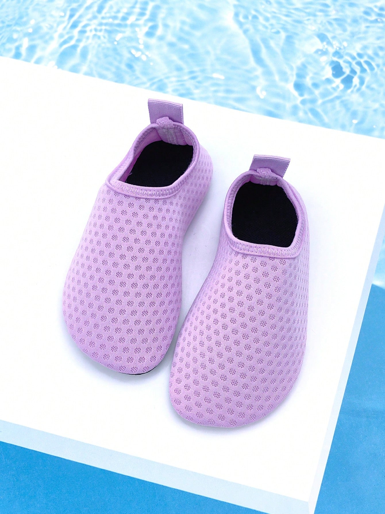 Girls breathable slip-on aqua socks for swimming and beach water sports featuring fabric upper and TPR outsole