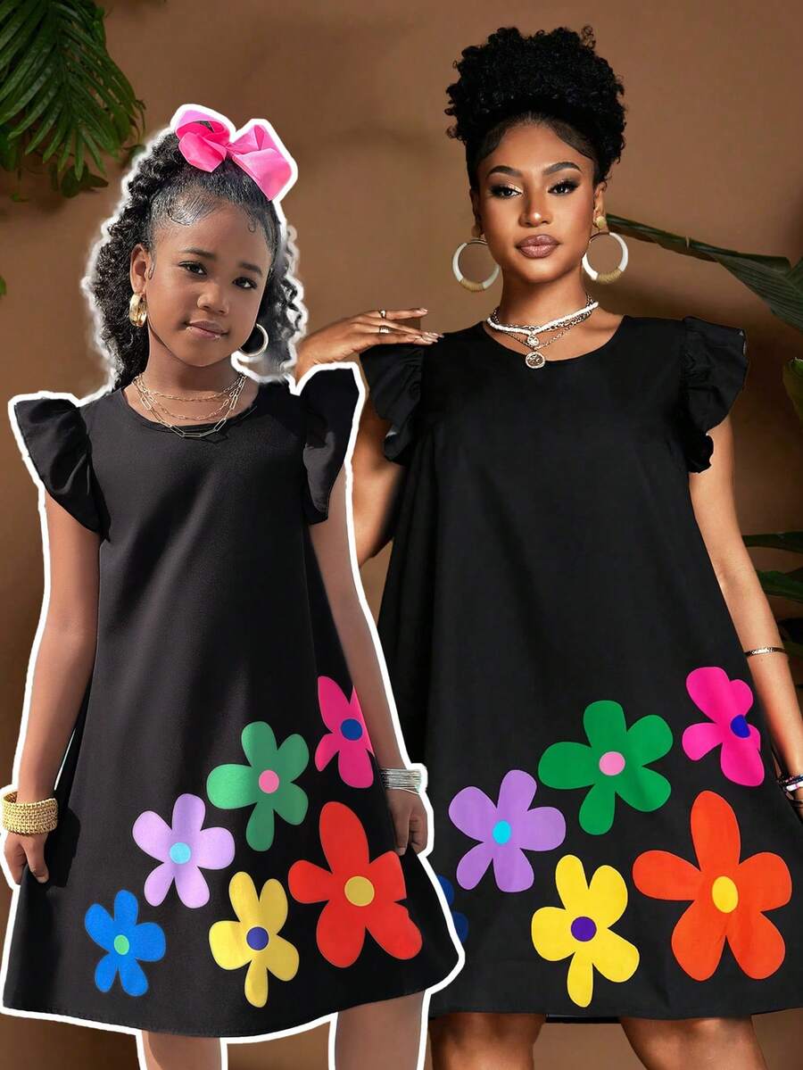 Tween girls sleeveless tropical floral mini dress in black with round neck and ruffle hem detail