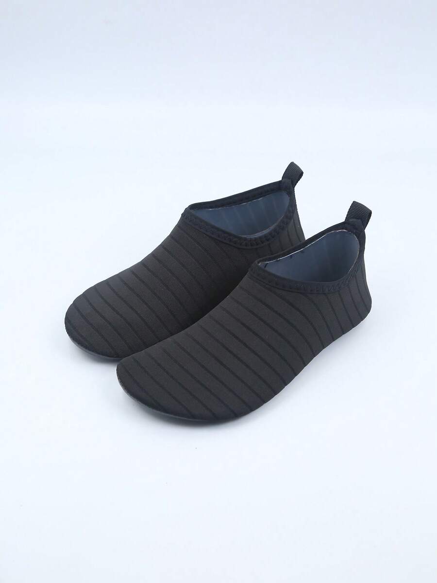 Kids slip-on aqua socks featuring geometric pattern, breathable Lycra upper, and non-slip TPR outsole for beach and water activities.