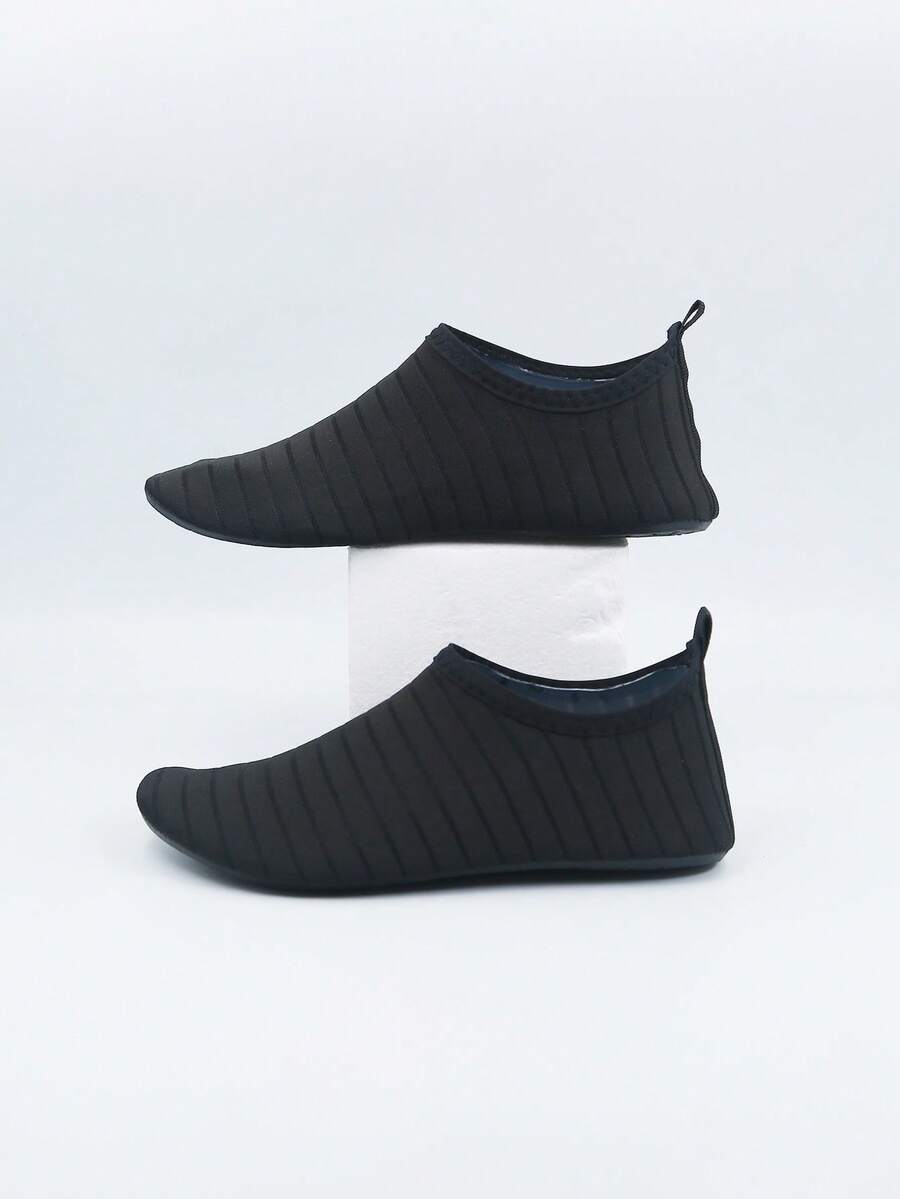 Kids slip-on aqua socks featuring geometric pattern, breathable Lycra upper, and non-slip TPR outsole for beach and water activities.