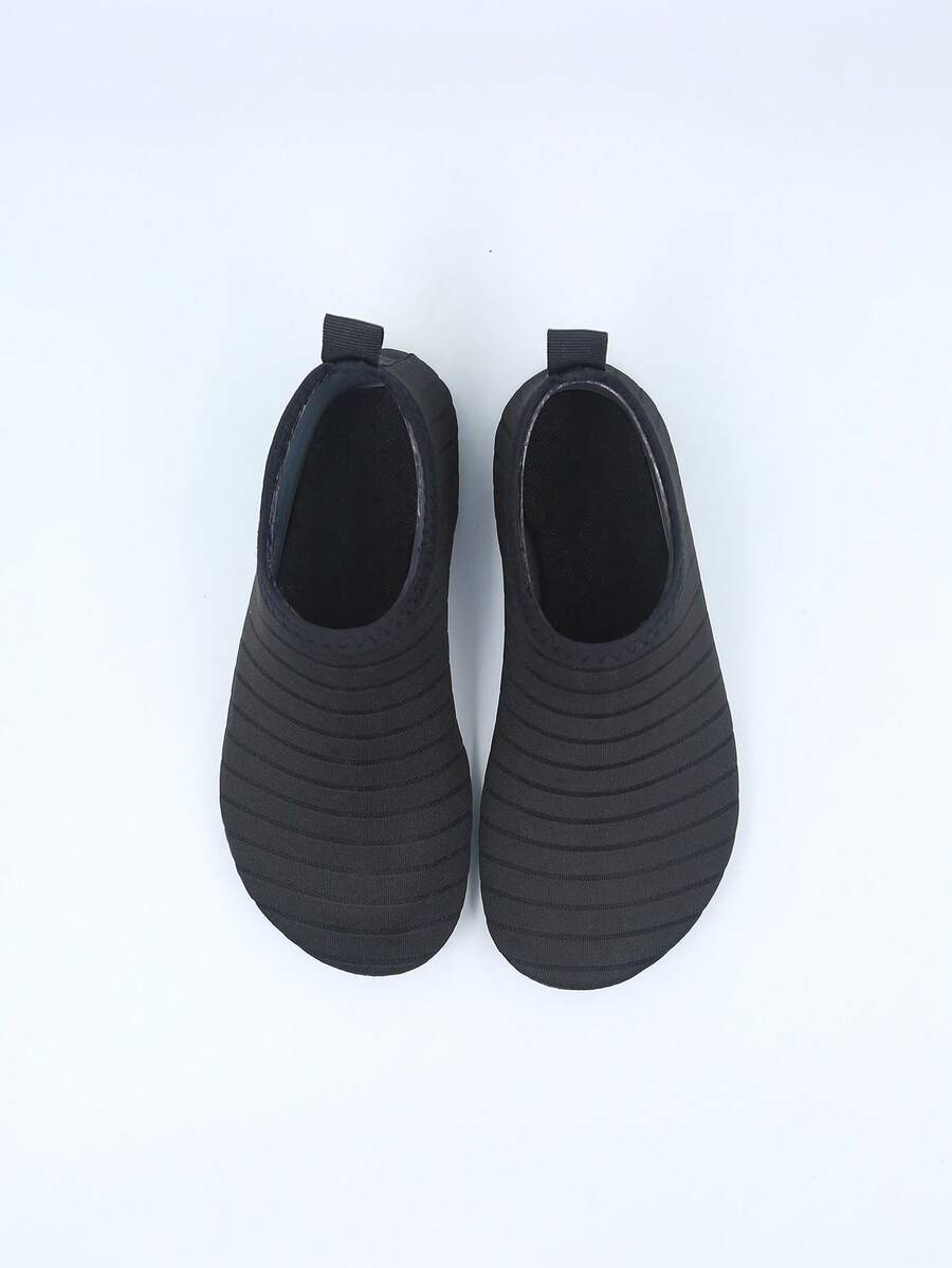 Kids slip-on aqua socks featuring geometric pattern, breathable Lycra upper, and non-slip TPR outsole for beach and water activities.