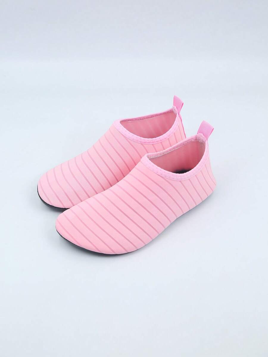 Kids slip-on aqua socks featuring geometric pattern, breathable Lycra upper, and non-slip TPR outsole for beach and water activities.
