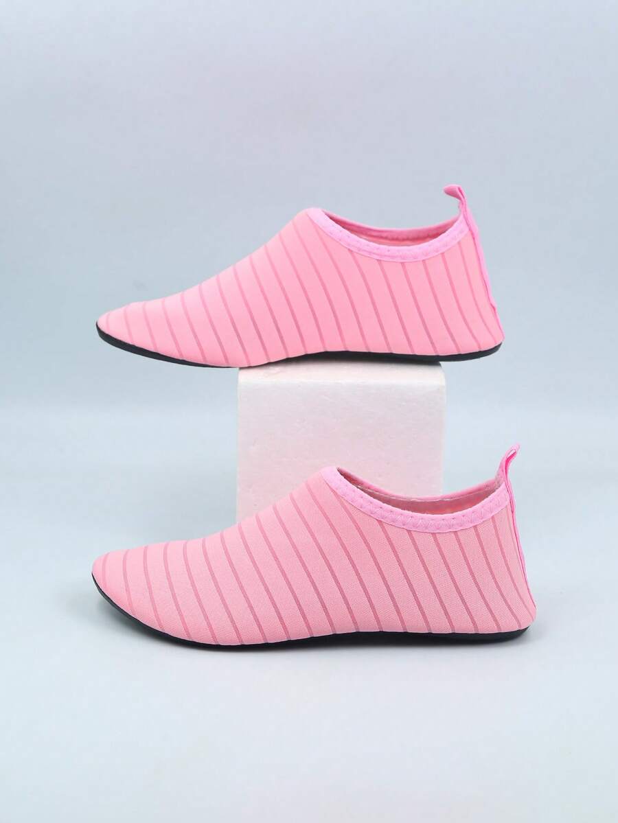Kids slip-on aqua socks featuring geometric pattern, breathable Lycra upper, and non-slip TPR outsole for beach and water activities.
