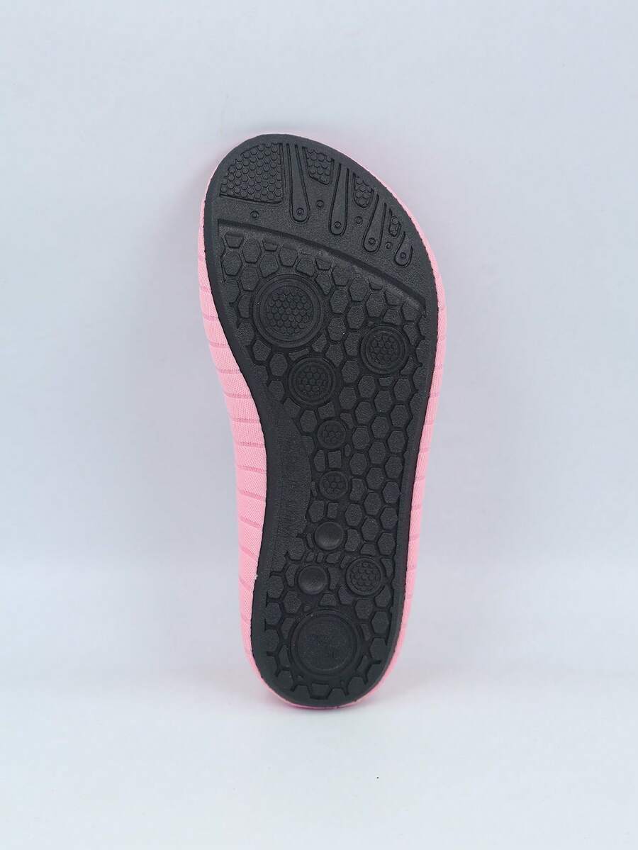 Kids slip-on aqua socks featuring geometric pattern, breathable Lycra upper, and non-slip TPR outsole for beach and water activities.