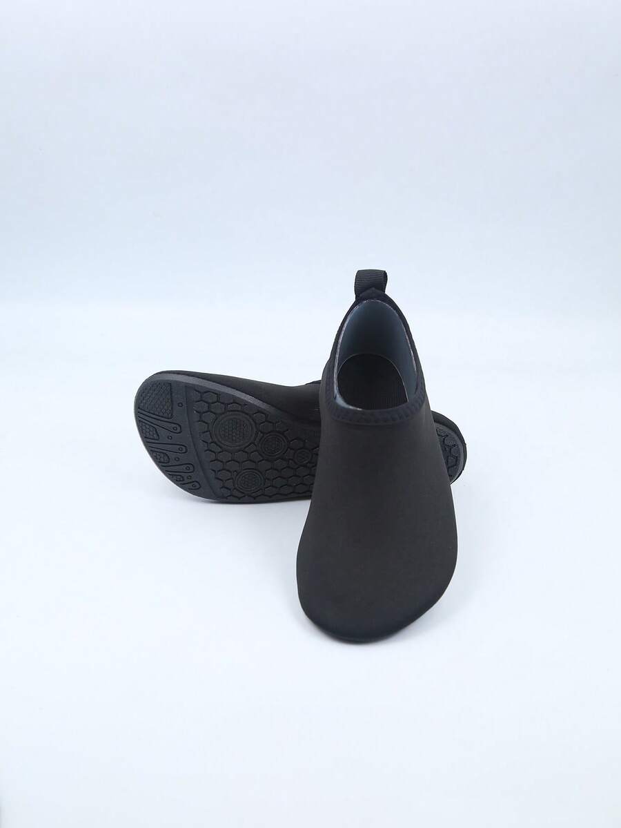 Kids slip-on aqua socks featuring geometric pattern, breathable Lycra upper, and non-slip TPR outsole for beach and water activities.