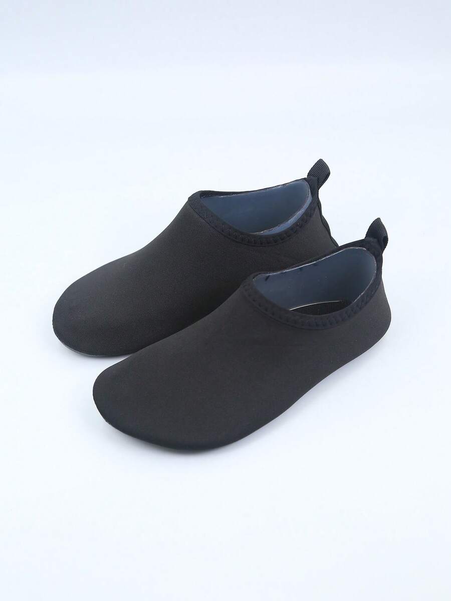 Kids slip-on aqua socks featuring geometric pattern, breathable Lycra upper, and non-slip TPR outsole for beach and water activities.
