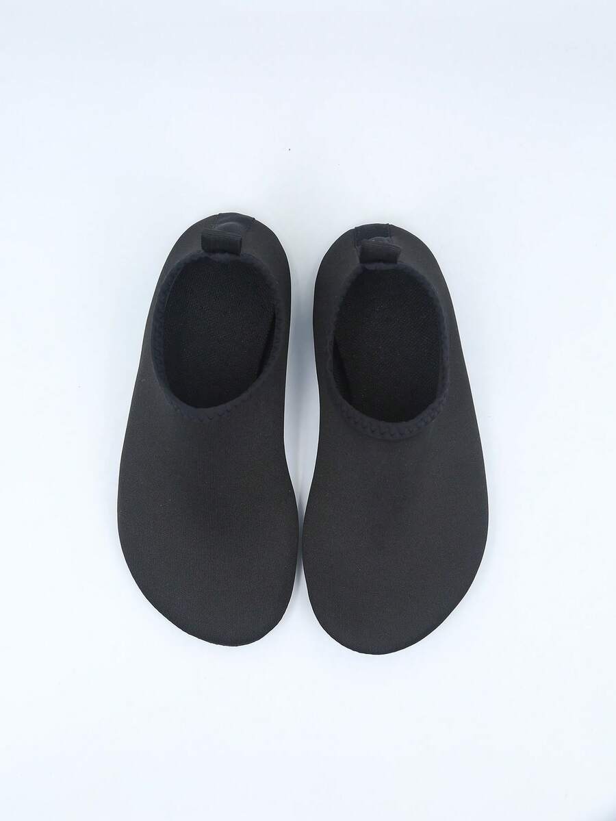 Kids slip-on aqua socks featuring geometric pattern, breathable Lycra upper, and non-slip TPR outsole for beach and water activities.